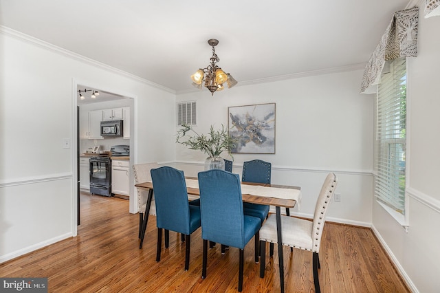 11 Basalt Dr, Fredericksburg, VA 22406 - dining space with a chandelier, ornamental molding, and light wood finished floors