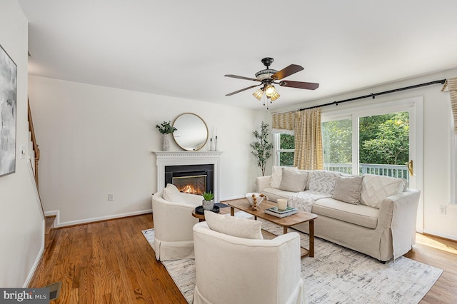 11 Basalt Dr, Fredericksburg, VA 22406 - living room featuring a fireplace with flush hearth, light wood-style floors, and a ceiling fan