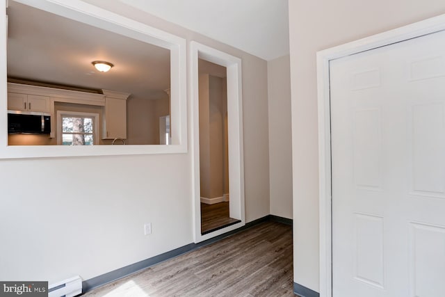 267 S 12th St, Lebanon, PA 17042 - spare room with a baseboard heating unit, wood finished floors, and baseboards