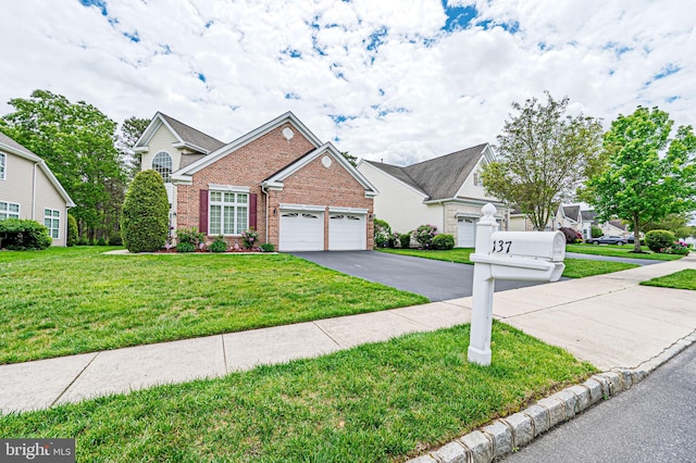 137 Keller Way, Mays Landing, NJ 08330 - view of front of property with brick siding, driveway, a front yard, and a garage
