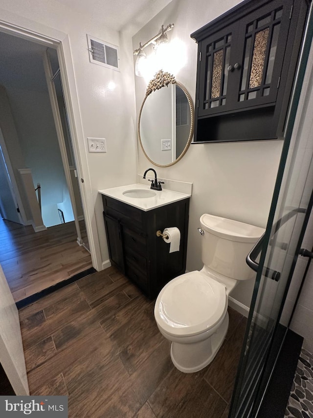 475 Ruffian Ct, Annapolis, MD 21409 - bathroom featuring vanity, baseboards, wood finished floors, and toilet