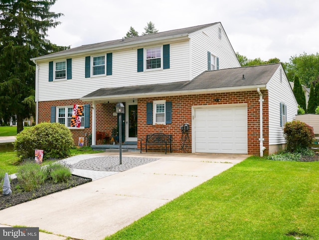 307 Townleigh Rd, Reisterstown, MD 21136 - view of front of home with brick siding, an attached garage, a front lawn, and driveway