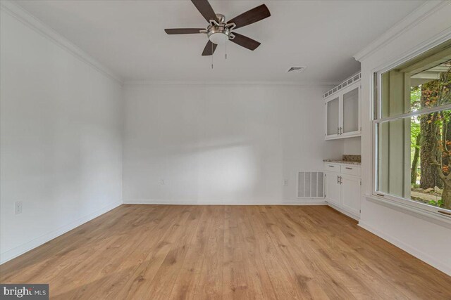 711 E Center St, Nesquehoning, PA 18240 - empty room with ornamental molding, light wood-style floors, a ceiling fan, and baseboards