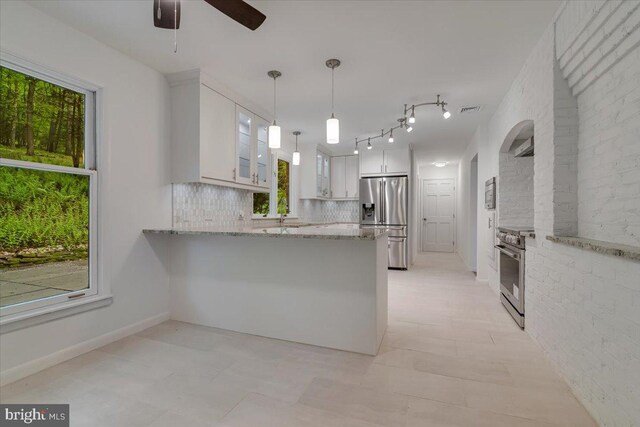 711 E Center St, Nesquehoning, PA 18240 - kitchen featuring stainless steel appliances, a peninsula, ceiling fan, glass insert cabinets, and white cabinets