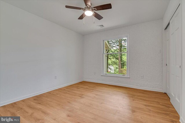 711 E Center St, Nesquehoning, PA 18240 - unfurnished bedroom featuring baseboards, light wood-style flooring, a closet, and ceiling fan