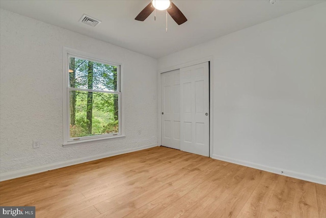 711 E Center St, Nesquehoning, PA 18240 - unfurnished bedroom featuring baseboards, light wood finished floors, a closet, and ceiling fan
