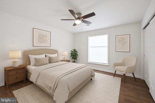711 E Center St, Nesquehoning, PA 18240 - bedroom with a closet, dark wood-style floors, baseboards, and a ceiling fan