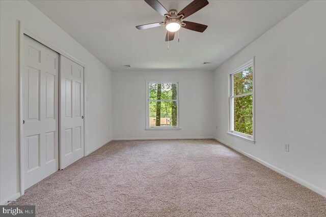 711 E Center St, Nesquehoning, PA 18240 - unfurnished bedroom featuring carpet floors, a closet, baseboards, and a ceiling fan