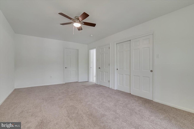 711 E Center St, Nesquehoning, PA 18240 - unfurnished bedroom with carpet floors, a ceiling fan, baseboards, and a closet