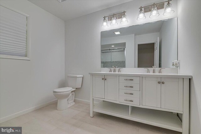 711 E Center St, Nesquehoning, PA 18240 - full bathroom featuring toilet, double vanity, baseboards, a shower, and tile patterned flooring