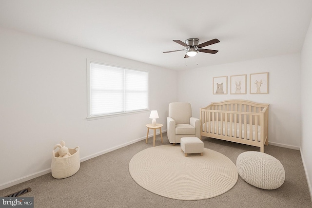 711 E Center St, Nesquehoning, PA 18240 - carpeted bedroom featuring a nursery area, baseboards, and a ceiling fan