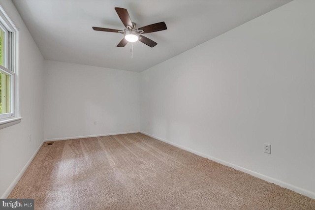 711 E Center St, Nesquehoning, PA 18240 - unfurnished room featuring light colored carpet, plenty of natural light, baseboards, and a ceiling fan