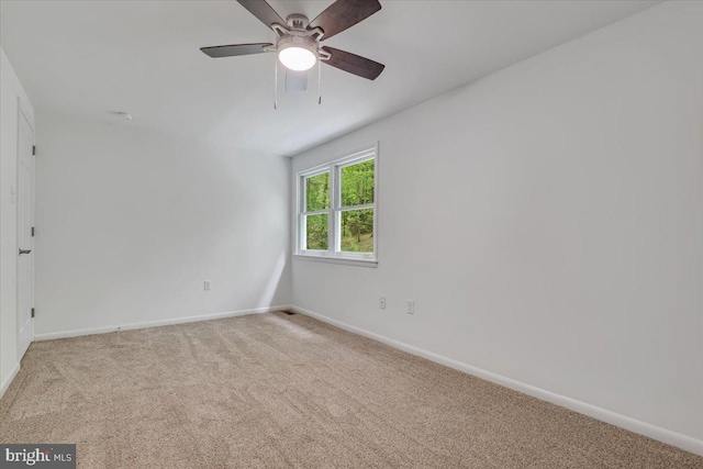 711 E Center St, Nesquehoning, PA 18240 - carpeted empty room with baseboards and a ceiling fan