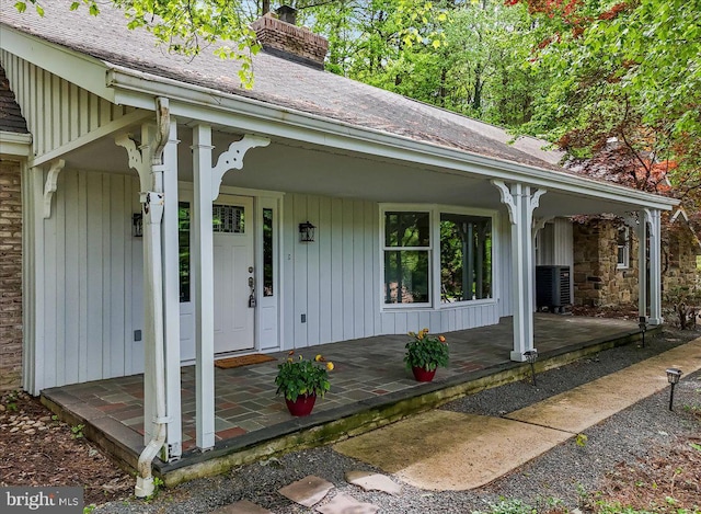 711 E Center St, Nesquehoning, PA 18240 - doorway to property with covered porch and a chimney