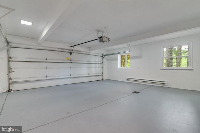 711 E Center St, Nesquehoning, PA 18240 - garage featuring a baseboard radiator and a garage door opener