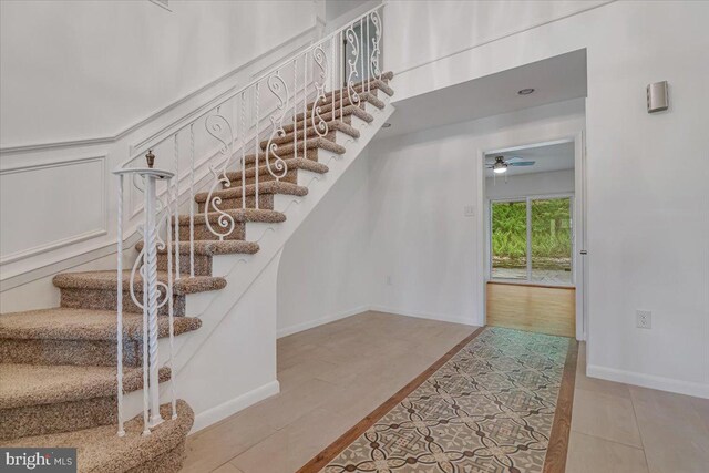 711 E Center St, Nesquehoning, PA 18240 - stairway featuring ceiling fan, baseboards, and tile patterned flooring