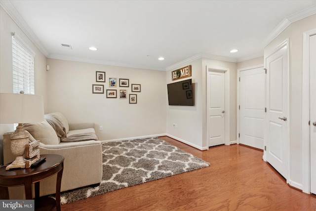 42 Mulberry Grn, Spring City, PA 19475 - living area with wood finished floors, recessed lighting, baseboards, and crown molding