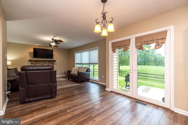 2127 Gable Ln, Quakertown, PA 18951 - living room with baseboards, dark wood finished floors, ceiling fan, and a chandelier