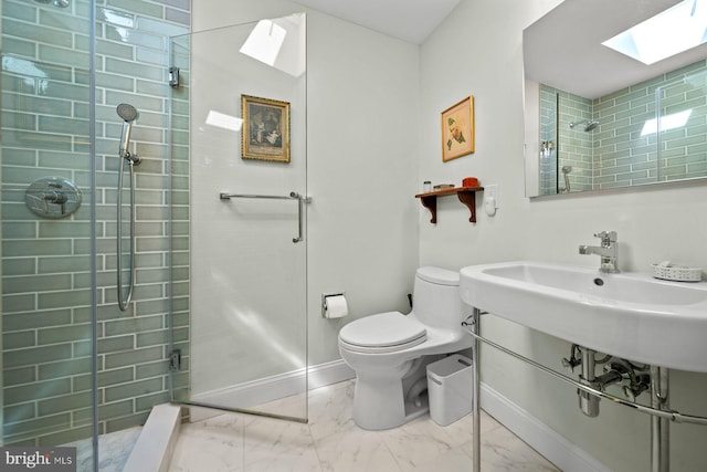 121 Hilltop Rd, Philadelphia, PA 19118 - bathroom with a skylight, toilet, a tile shower, marble look tile flooring, and baseboards
