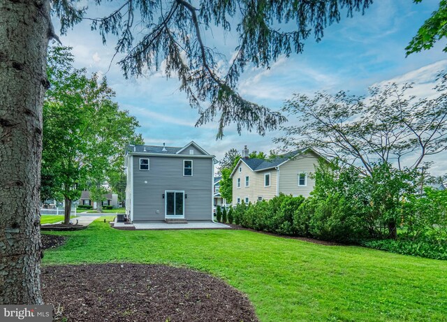 58 Park Ave, Hamilton, NJ 08690 - rear view of house featuring a patio area and a lawn