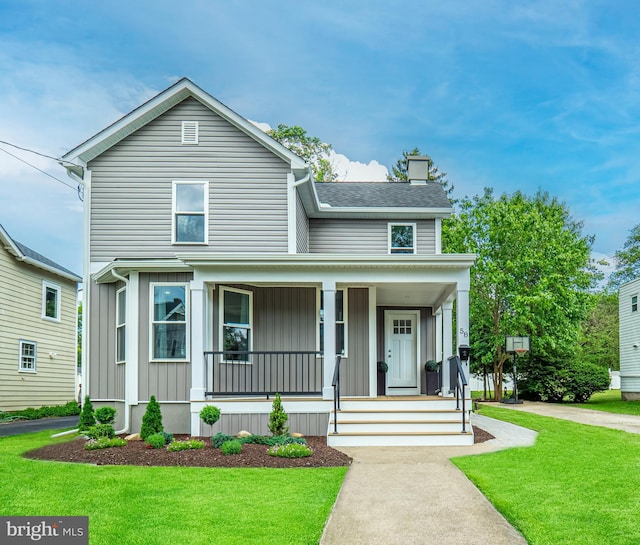 58 Park Ave, Hamilton, NJ 08690 - view of front of property featuring a porch, a front yard, board and batten siding, and roof with shingles