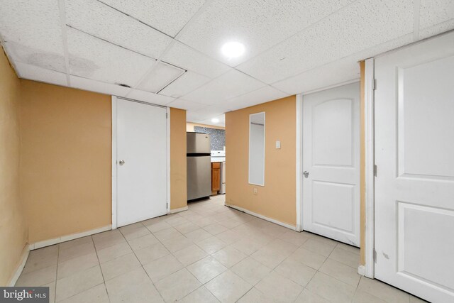 7252 Brent Rd, Upper Darby, PA 19082 - finished below grade area with freestanding refrigerator, baseboards, and a drop ceiling