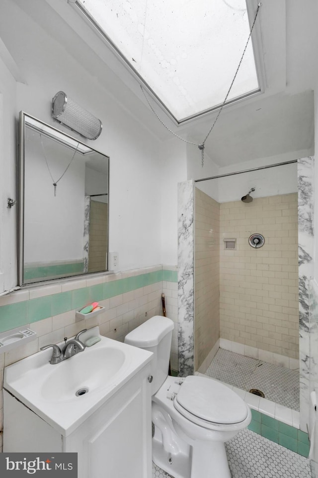 7252 Brent Rd, Upper Darby, PA 19082 - full bath with a shower stall, vanity, toilet, tile walls, and wainscoting