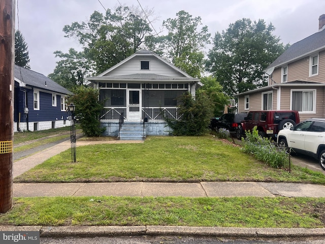 511 Passmore Ave, Hammonton, NJ 08037 - view of front of house with a sunroom and a front yard