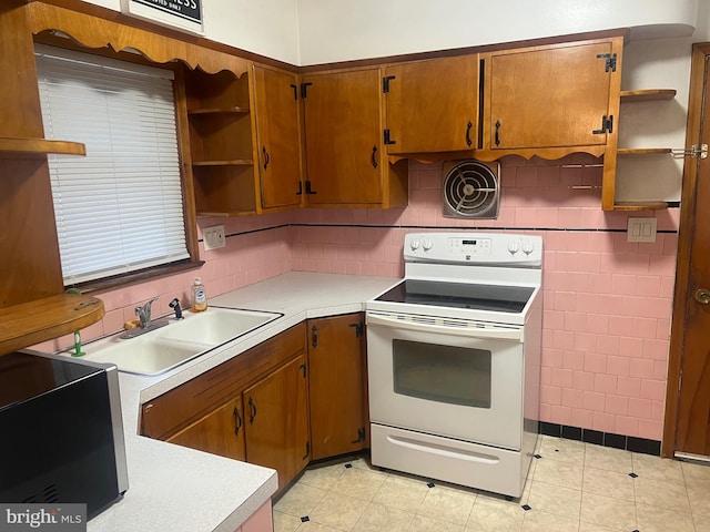511 Passmore Ave, Hammonton, NJ 08037 - kitchen featuring electric stove, open shelves, light countertops, and a sink