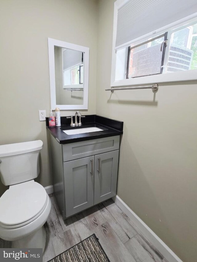 402 W Maple Ave, Sterling, VA 20164 - bathroom featuring baseboards, vanity, and plenty of natural light