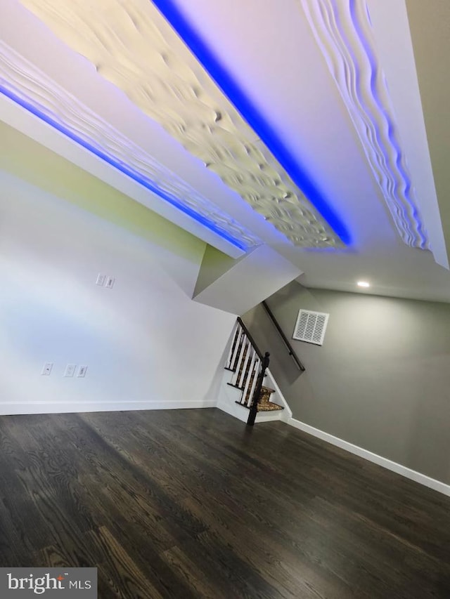 402 W Maple Ave, Sterling, VA 20164 - unfurnished living room featuring baseboards, wood finished floors, and stairway