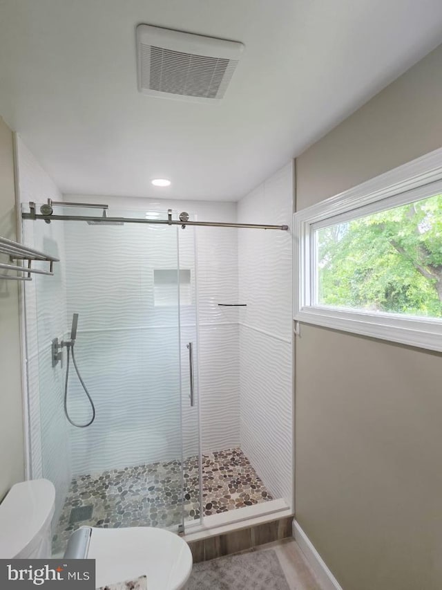 402 W Maple Ave, Sterling, VA 20164 - bathroom featuring toilet, a shower stall, and baseboards