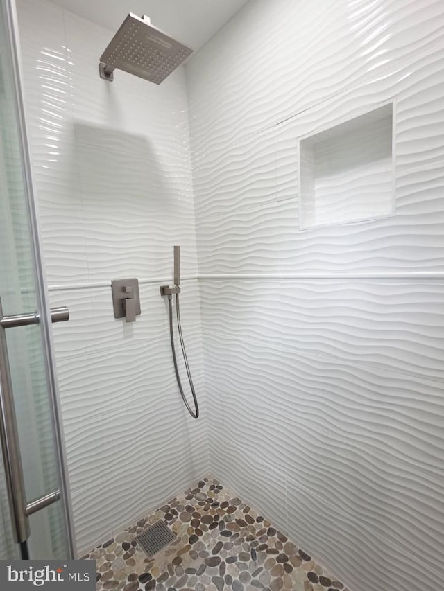402 W Maple Ave, Sterling, VA 20164 - full bath with a tile shower and stone finish flooring