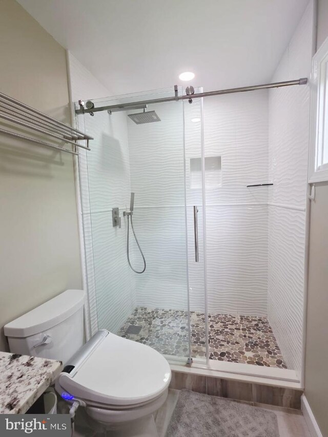 402 W Maple Ave, Sterling, VA 20164 - bathroom featuring toilet, a stall shower, and vanity