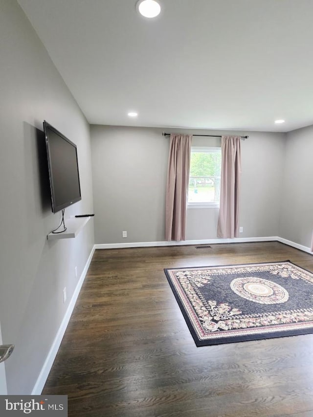 402 W Maple Ave, Sterling, VA 20164 - unfurnished living room featuring wood finished floors, baseboards, and recessed lighting