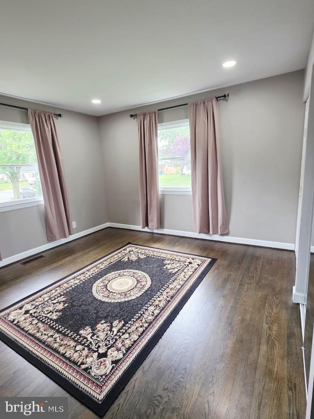 402 W Maple Ave, Sterling, VA 20164 - spare room with wood finished floors, baseboards, and recessed lighting