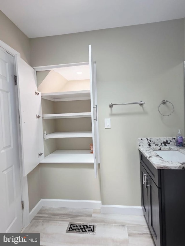 402 W Maple Ave, Sterling, VA 20164 - bathroom featuring vanity and baseboards