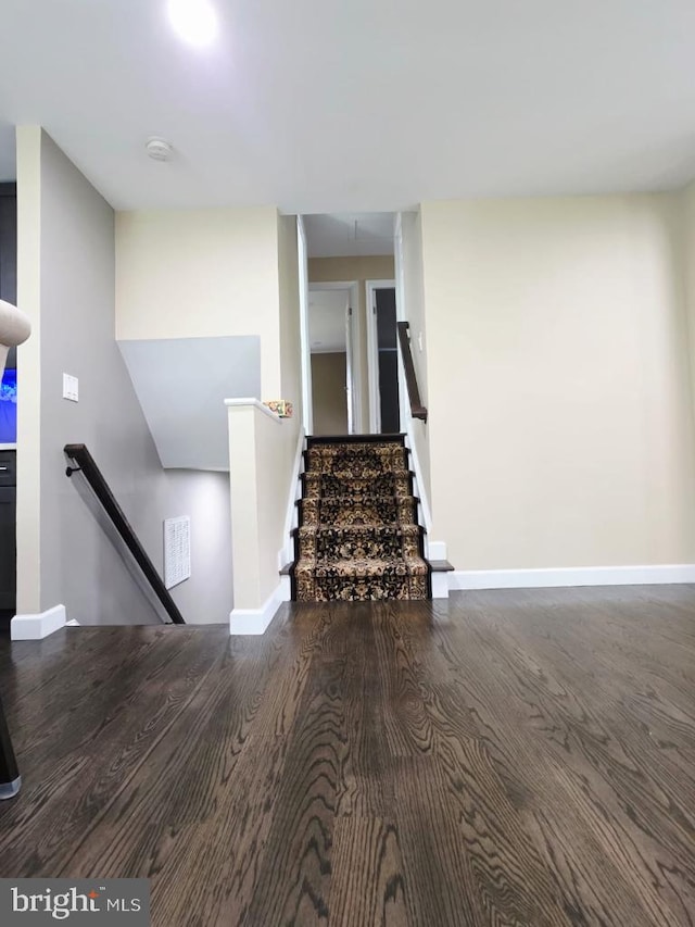 402 W Maple Ave, Sterling, VA 20164 - stairs with baseboards and wood finished floors