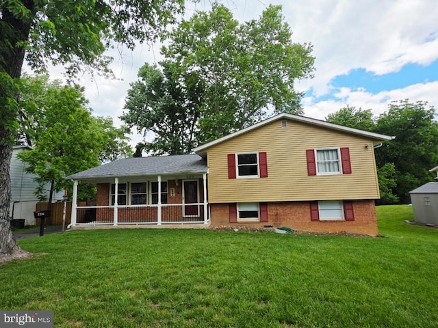 402 W Maple Ave, Sterling, VA 20164 - view of front of house with a front yard and brick siding