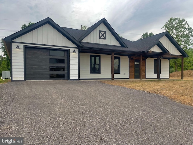 211 Workman Dr, Keyser, WV 26726 - view of front facade with board and batten siding, an attached garage, asphalt driveway, and a shingled roof