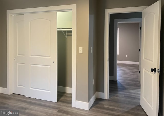 211 Workman Dr, Keyser, WV 26726 - unfurnished bedroom with baseboards, dark wood-style floors, and a closet