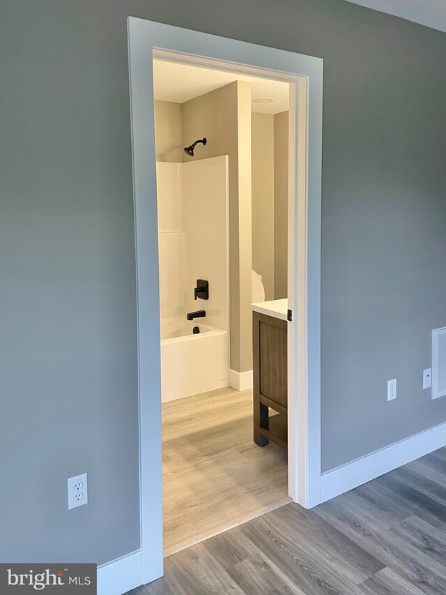 211 Workman Dr, Keyser, WV 26726 - full bath with vanity, wood finished floors, shower / washtub combination, and baseboards