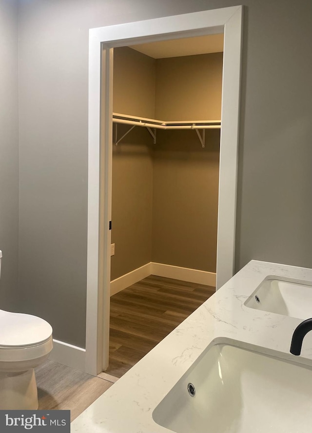211 Workman Dr, Keyser, WV 26726 - bathroom with toilet, baseboards, wood finished floors, and a spacious closet