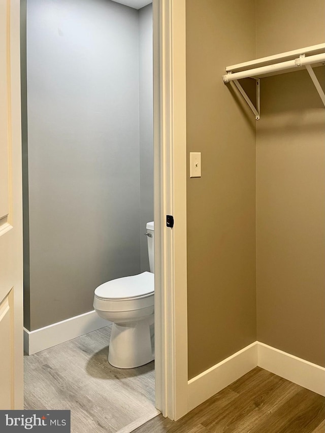 211 Workman Dr, Keyser, WV 26726 - bathroom featuring wood finished floors, baseboards, and toilet