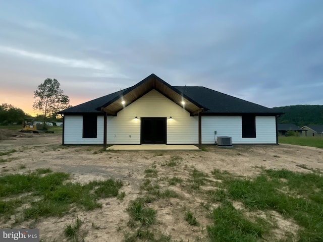 211 Workman Dr, Keyser, WV 26726 - back of house at dusk with central AC