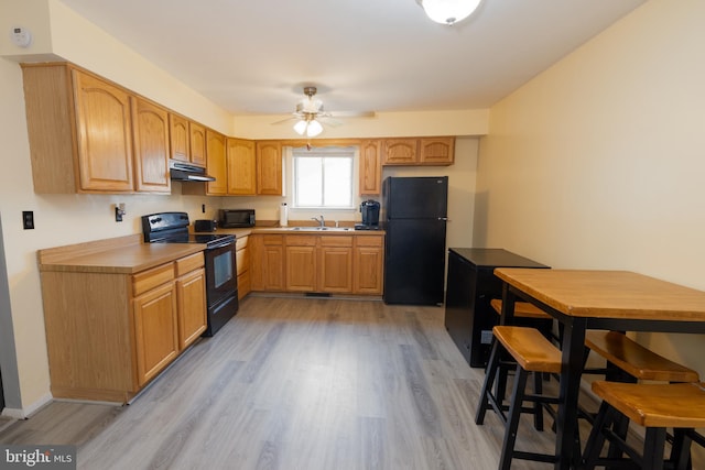 207 Coville Dr, Browns Mills, NJ 08015 - kitchen featuring black appliances, under cabinet range hood, a ceiling fan, and light wood-style floors
