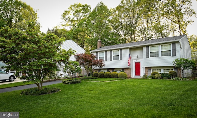8110 Winter Blue Ct, Springfield, VA 22153 - split foyer home featuring a front yard and a chimney