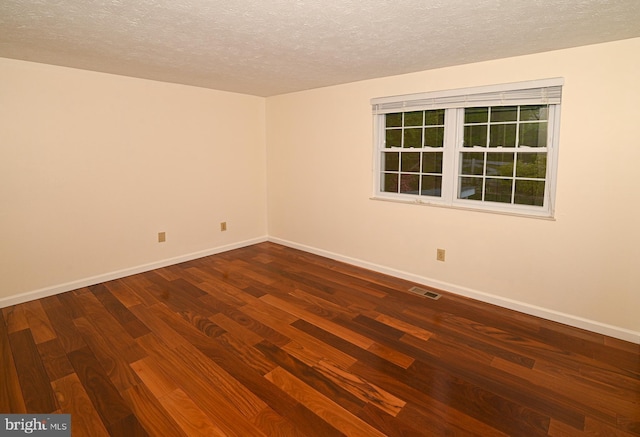 8110 Winter Blue Ct, Springfield, VA 22153 - unfurnished room featuring dark wood-style floors, baseboards, and a textured ceiling