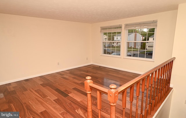 8110 Winter Blue Ct, Springfield, VA 22153 - empty room featuring wood finished floors, baseboards, and a textured ceiling