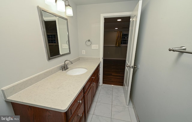 8110 Winter Blue Ct, Springfield, VA 22153 - bathroom with marble finish flooring, vanity, and baseboards